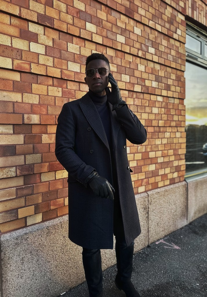 Reiss London double-breasted coat styled with gloves and sunglasses — men’s autumn outerwear essential. Lance Slate Autumn Style